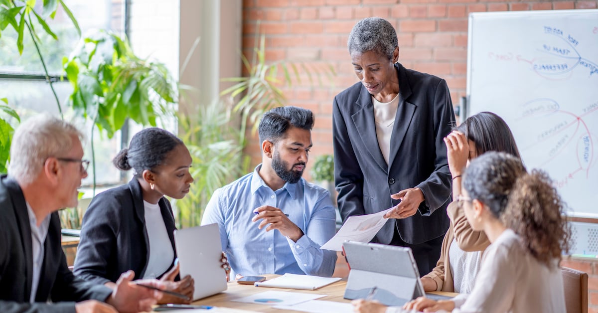 Sales manager leads a team meeting 