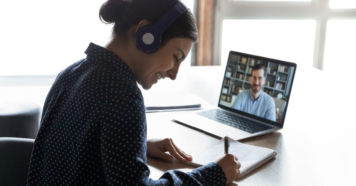 A seller records notes during a discovery call with a buyer.