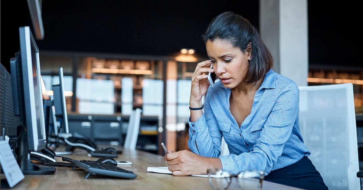 A seller records notes during a discovery call.