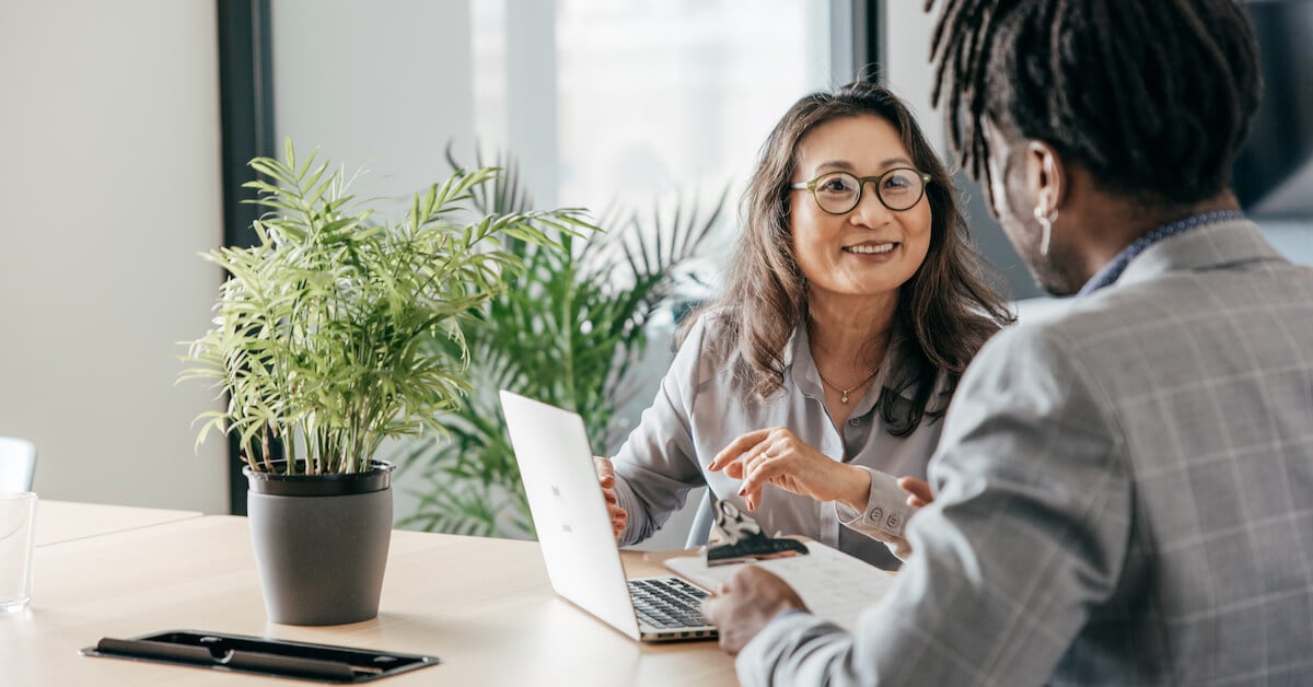 Two sales professionals hold a coaching conversation