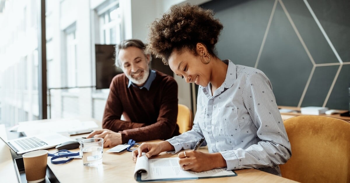A buyer and a seller discuss the terms of a contract to close out a deal.